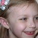 yellow, pink, and blue polka dot circle bow with flower, hairclip