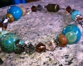 Turquoise beaded stone with green and brown swarovski bracelet