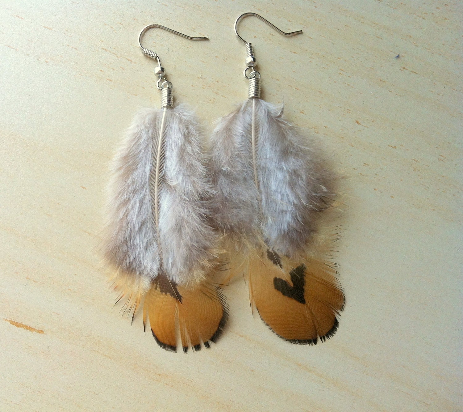 Very cute ember feather earrings