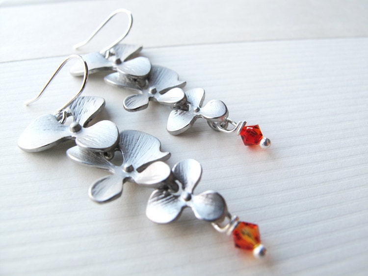 Hibiscus silver flowers dangle earrings with Swarovski crystals.