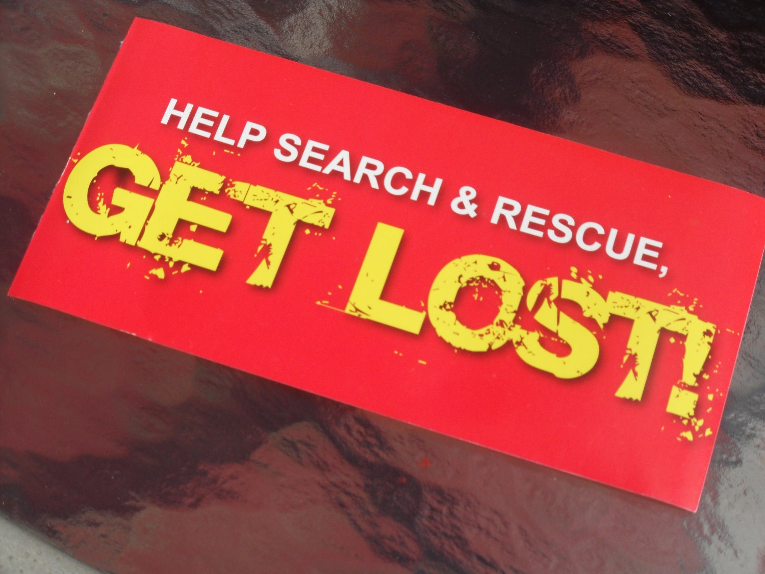 Help search & rescue, GET LOST ...fire engine red, white, and yellow funny car bumper sticker humorous gag gift