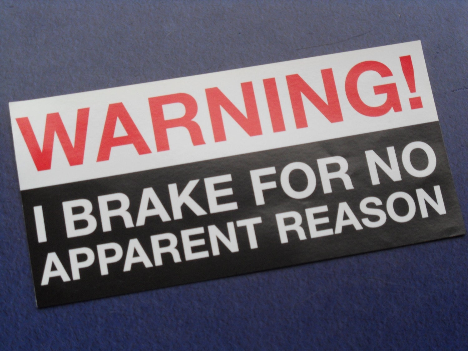 Warning, I brake for no apparent reason...red, black, and white humorous car bumper sticker gag gift.