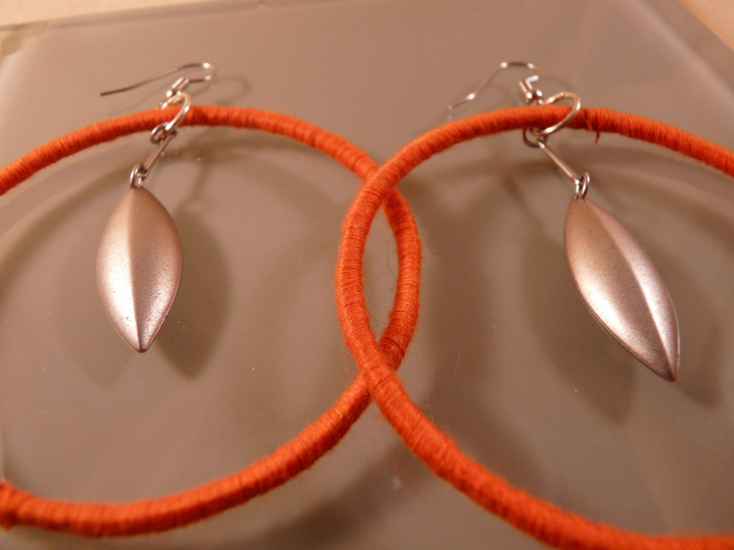 Large Orange Hoops with Silvertone Recycled Leaf Dangles