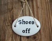 antique china label on old  shoe last, handpainted "shoes off"