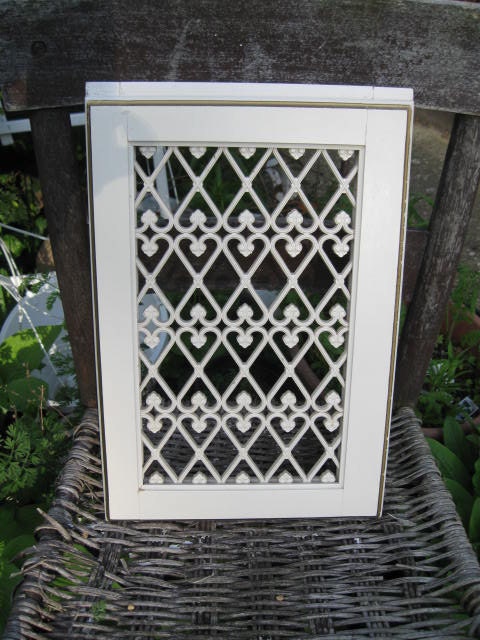 Doors from a Vintage Hutch that was used on a Vintage Desk the top portion for hidden treasures
