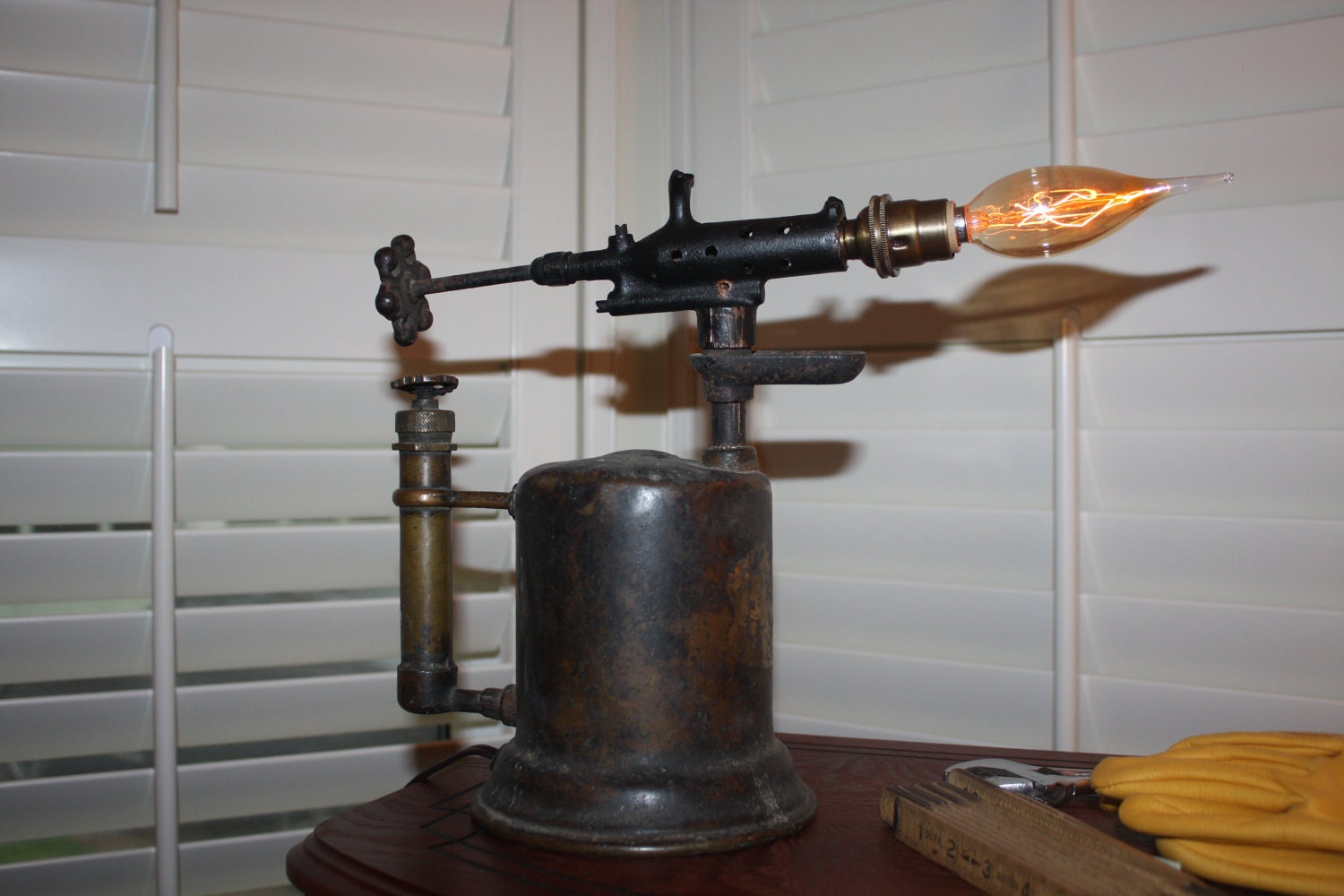 Antique brass blowtorch lamp.