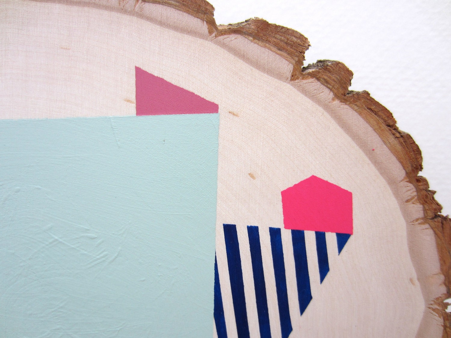 Wood wall art geometric pastel tree slice painting with colorful abstract shapes and stripes: original art