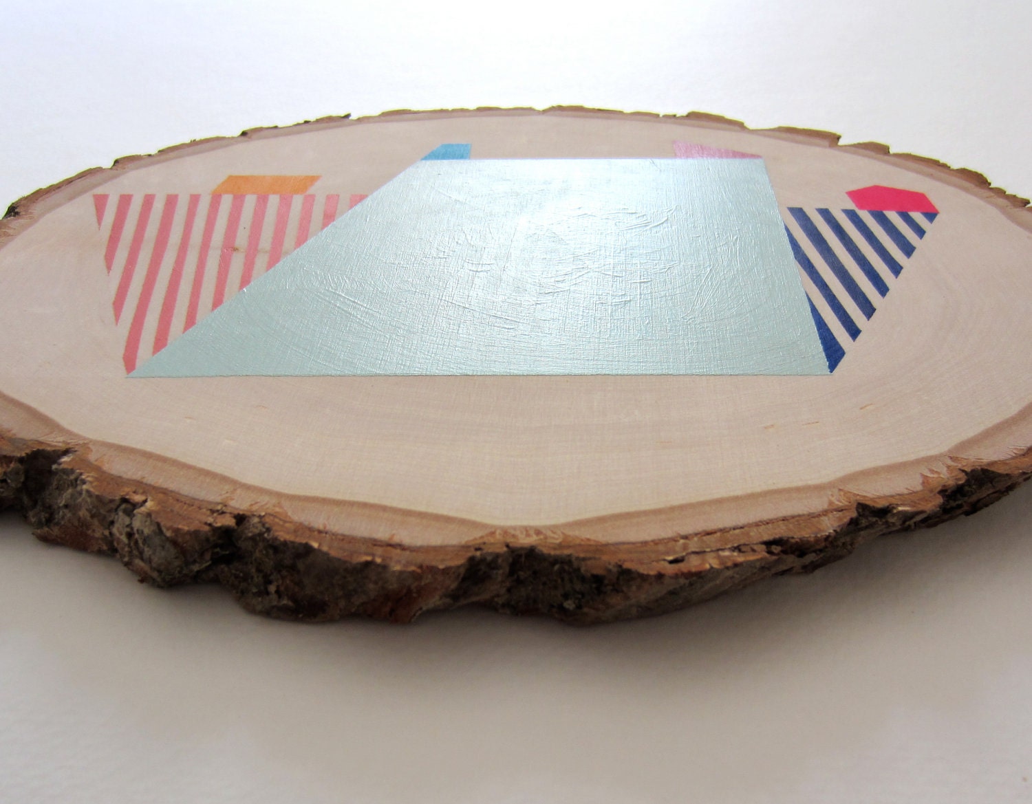 Wood wall art geometric pastel tree slice painting with colorful abstract shapes and stripes: original art