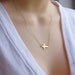 Taylor Gold Sideways Horizontal Cross Necklace - Celebrity jewelry inspired B