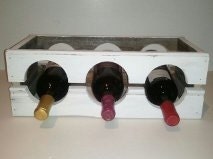 Rustic whitewashed wine rack.