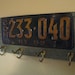 Vintage coat rack made with a real vintage license plate-barnwood- and vintage brass hooks- NEW YORK