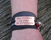 May the odds be ever in your favor Hunger Games Bracelet On Grey Stone Silk Ribbon Wrap With Fresh Water Pearl