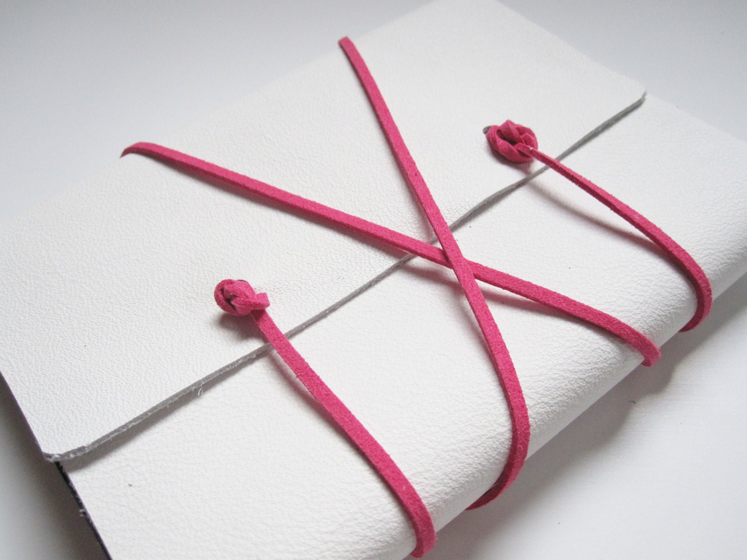 medium white leather journal with pink wrap cord