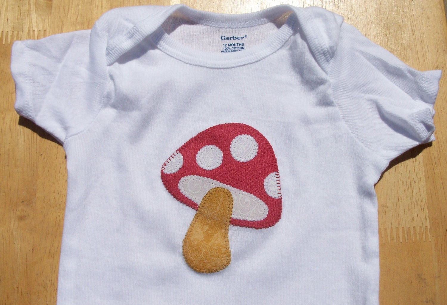 Red Mushroom Baby Onesie