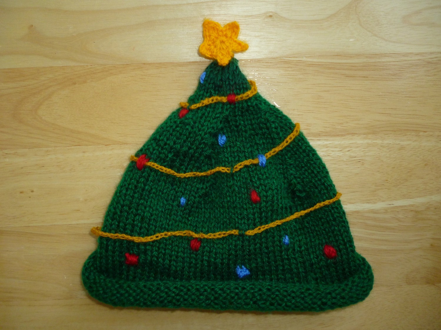 Items similar to knitted christmas tree hat on Etsy
