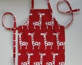 Toddler boy or girl apron in red giraffe print.  Sturdy cotton duck fabric.  Pocket on bib, adjustable ties.  Sizes 1-2, 3-4, 5-6.