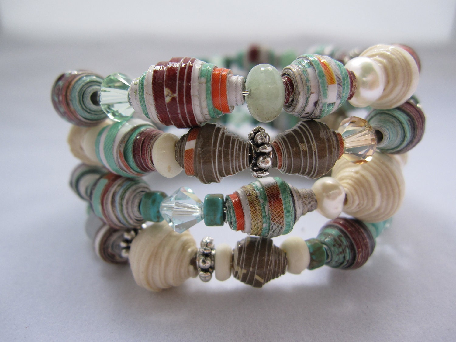 Wrap bangle bracelet made with paper beads accented with metal beads, glass and swaroski crystal beads
