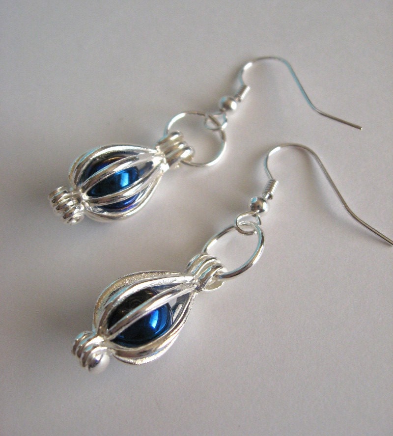 Simple caged blue bead earrings