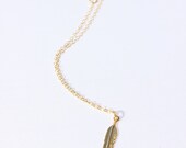 Thin gold chain feather charm bracelet
