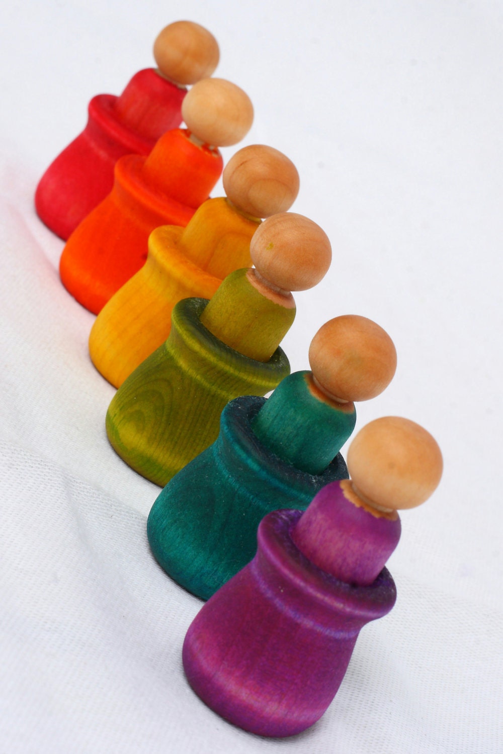 Montessori inspired matching game with peg dolls and cups