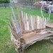 fan back bench with table built on. made from driftwood.