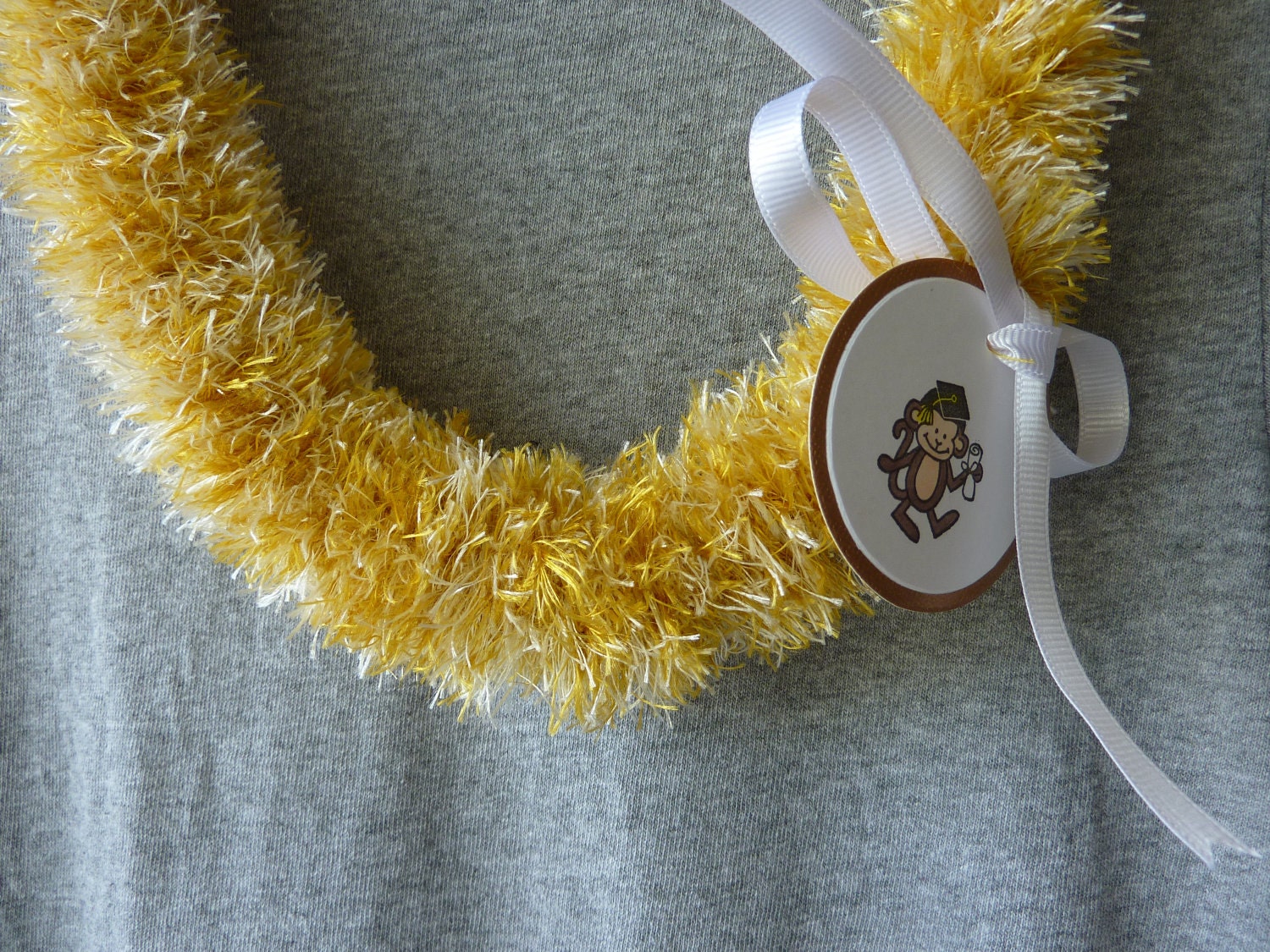 Items similar to Gold&pikake Hawaiian eyelash yarn lei for graduation