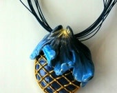 Oval pendant necklace with gold thread and blue leaf from polymer clay fimo handmade