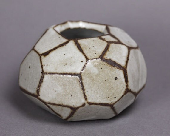 Faceted brown and white vase.