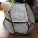Faceted brown and white vase.