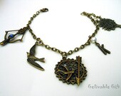HG Mokingjay bird charms bracelet, Charm Bracelet Mockingjay and Katniss's bow and arrow BHG01