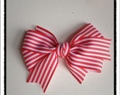 Classic red and white striped ribbon hair bow.