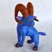 brightly painted wooden ram