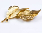 Vintage DFA gold tone leaf brooch