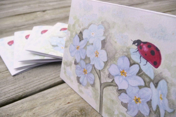 Forget me not watercolor painting red ladybug blue flowers eco conscious stationery set summer gardening inspired