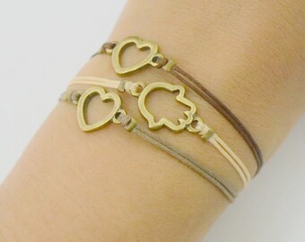 Tricolor cord Bracelet - unique bracelet three cords (Beige, light brown and dark brown) and three bronze charms: 2 hearts and 1 Hamsa.