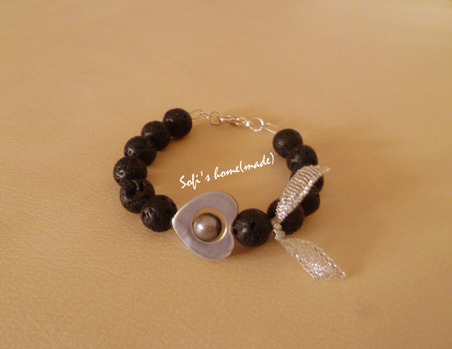 Handmade bracelet with lava stones / beads and a lovely pearl into a shell heart plus free gift.