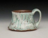 white and green terra cotta mug