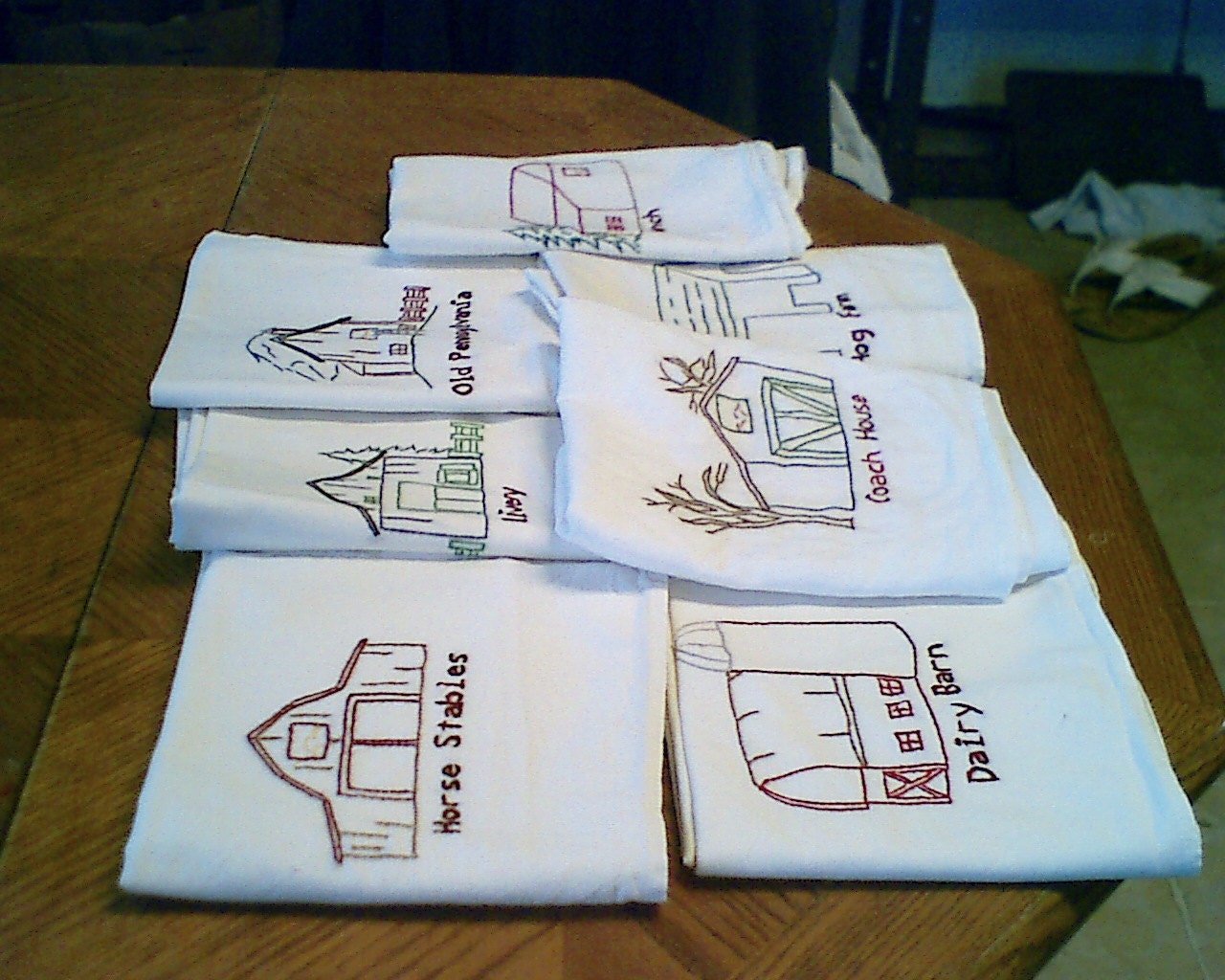 old style barns on a set of 7 dishtowels