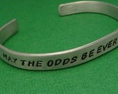Hunger Games Inspired - May The Odds Be Ever In Your Favor -  A Hand Stamped Aluminum Bracelet