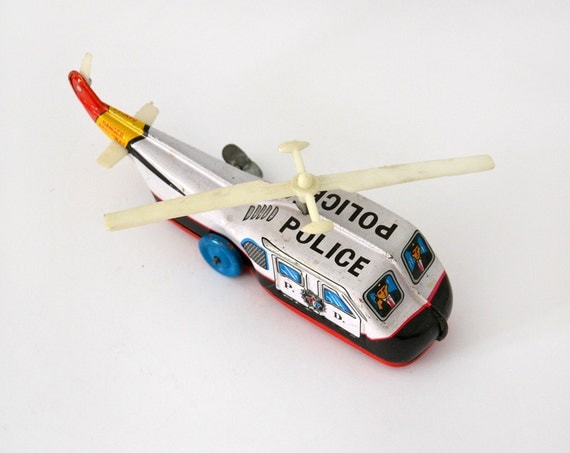 Items similar to Vintage Police helicopter tin toy on Etsy