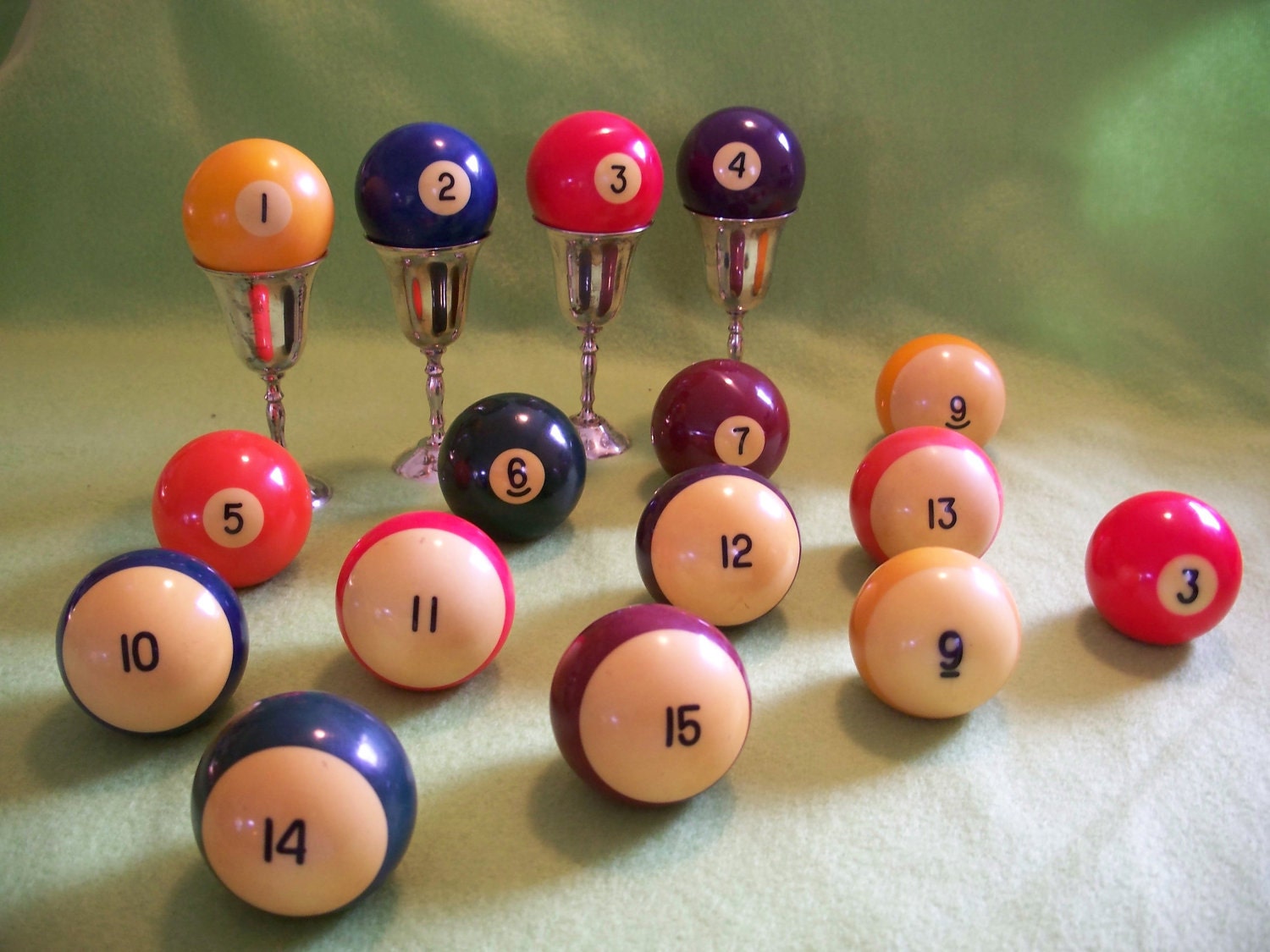 Four Bakelite Pool Billiard Balls