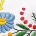 Oval embroidered tablecloths with Hungarian motifs