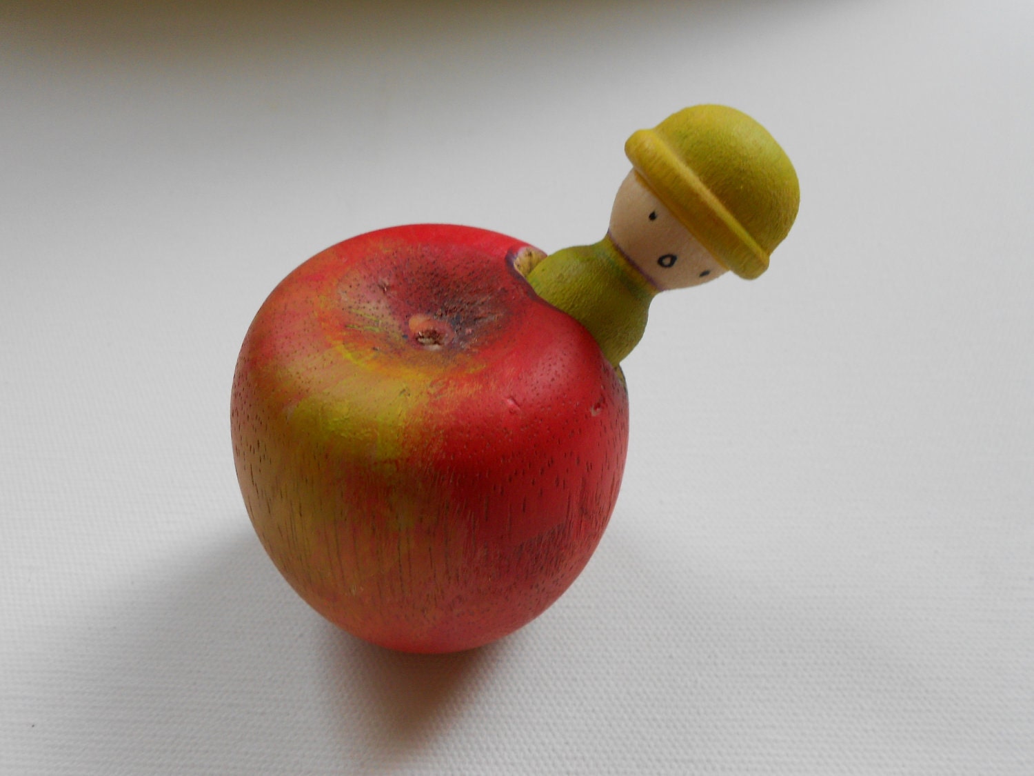 Wooden apple and worm man toy