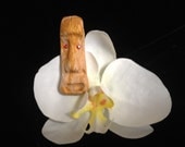 Tiki on a beautiful tropical orchid hair clip