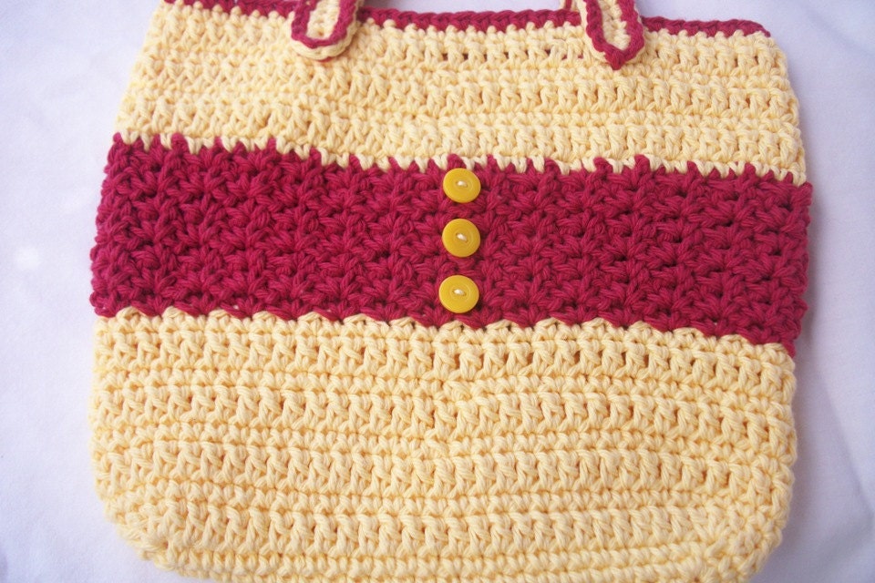 Crocheted tote bag of red and yellow cotton yarn with yellow button accents