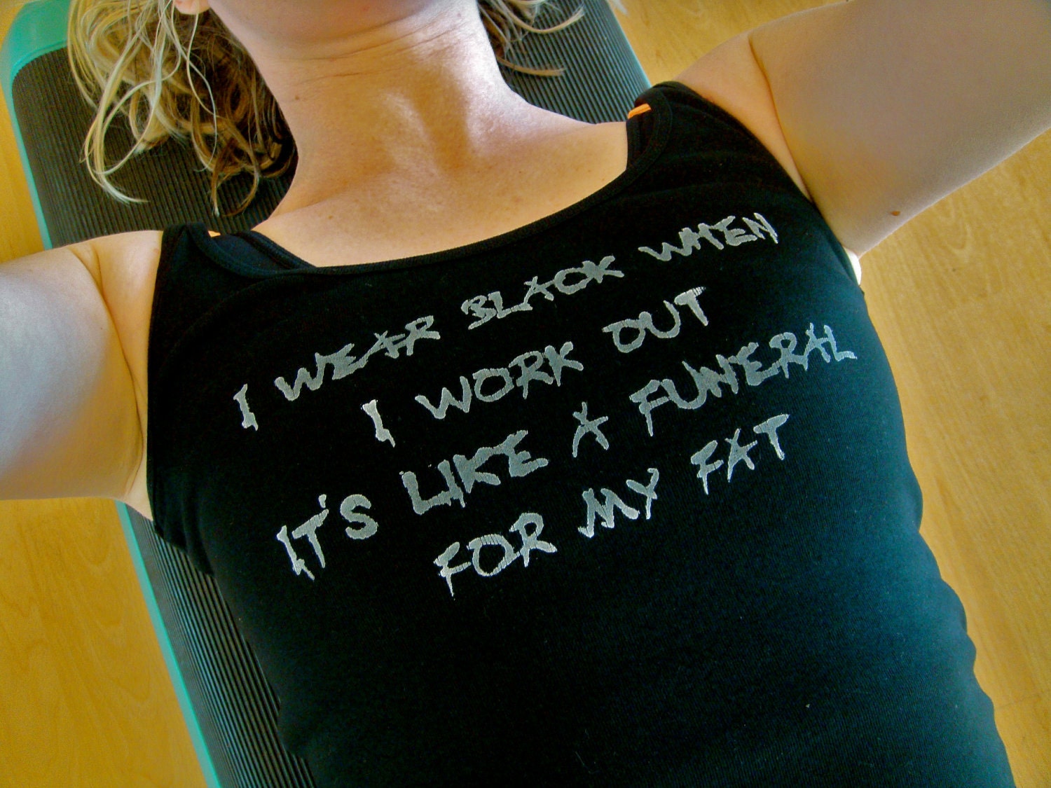 I wear black when I work out. It's like a funeral for my fat done in vintage looking silk screen on a black workout tank with a sliced back