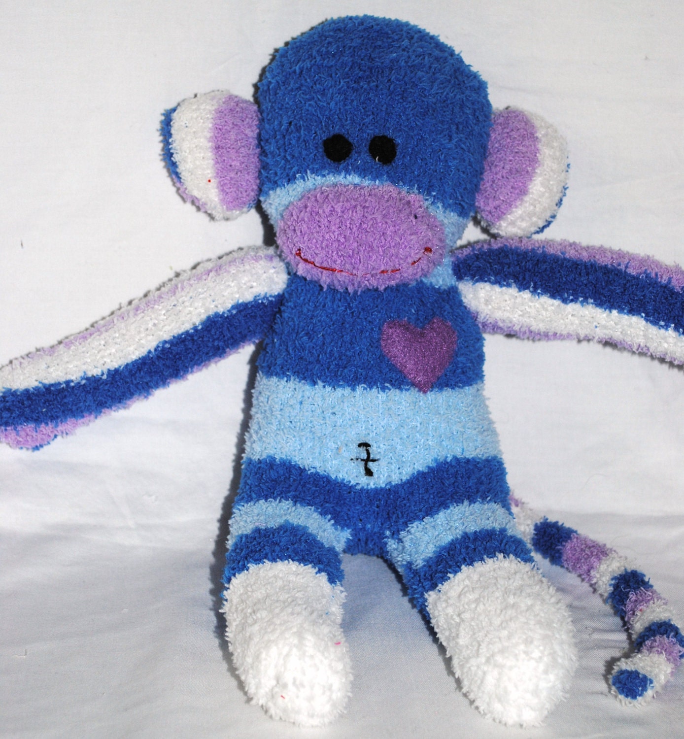 LULU..... a purple, blue and white striped sock monkey