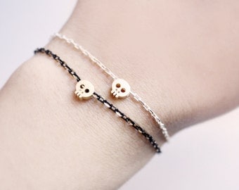 tiny skull bracelet - matt 14kt gold plated skull on BLACK chain