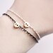 tiny skull bracelet - matt 14kt gold plated skull on BLACK chain
