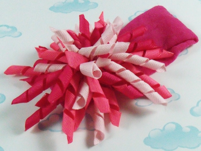 Korker bow Pink pink pink curly/pom pom hair bow on nylon headband